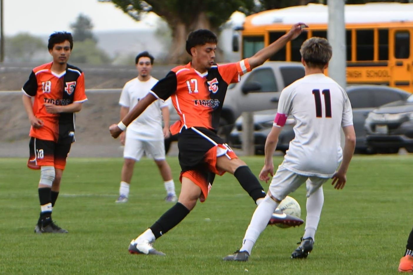 Junior Chavez (17) plays the ball past a Toppenish defender during the Tigers' 5-2 win over the Wildcats on April 21. Chavez recorded nine goals and a team-high five assists and earned second-team all-conference honors.