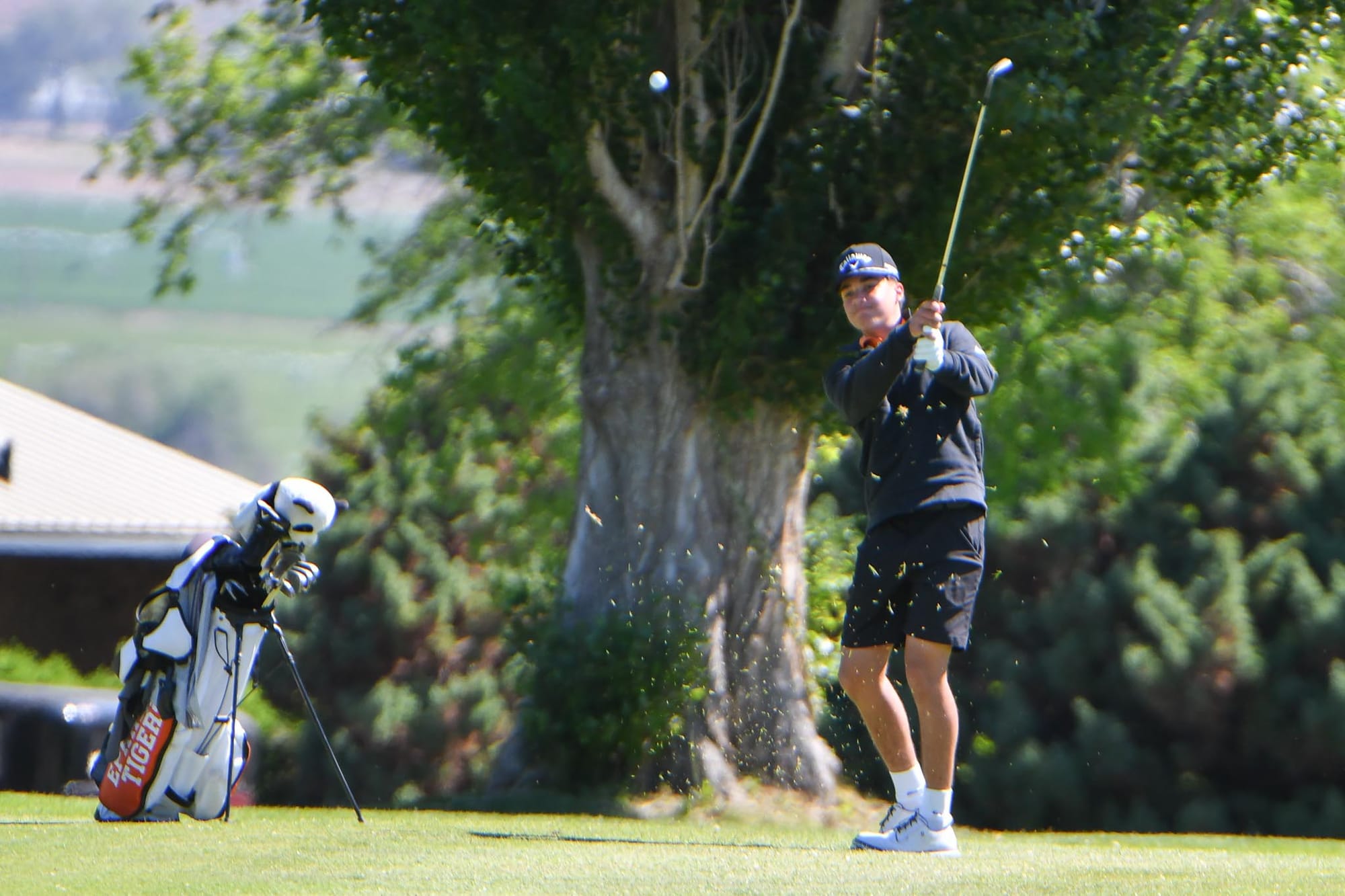 Jett Julian chips during the district tournament at Lakeview Golf & Country Club on Monday, May 11. Julian shot 94 as an individual competitor and earned honorable-mention all-conference honors for the season.