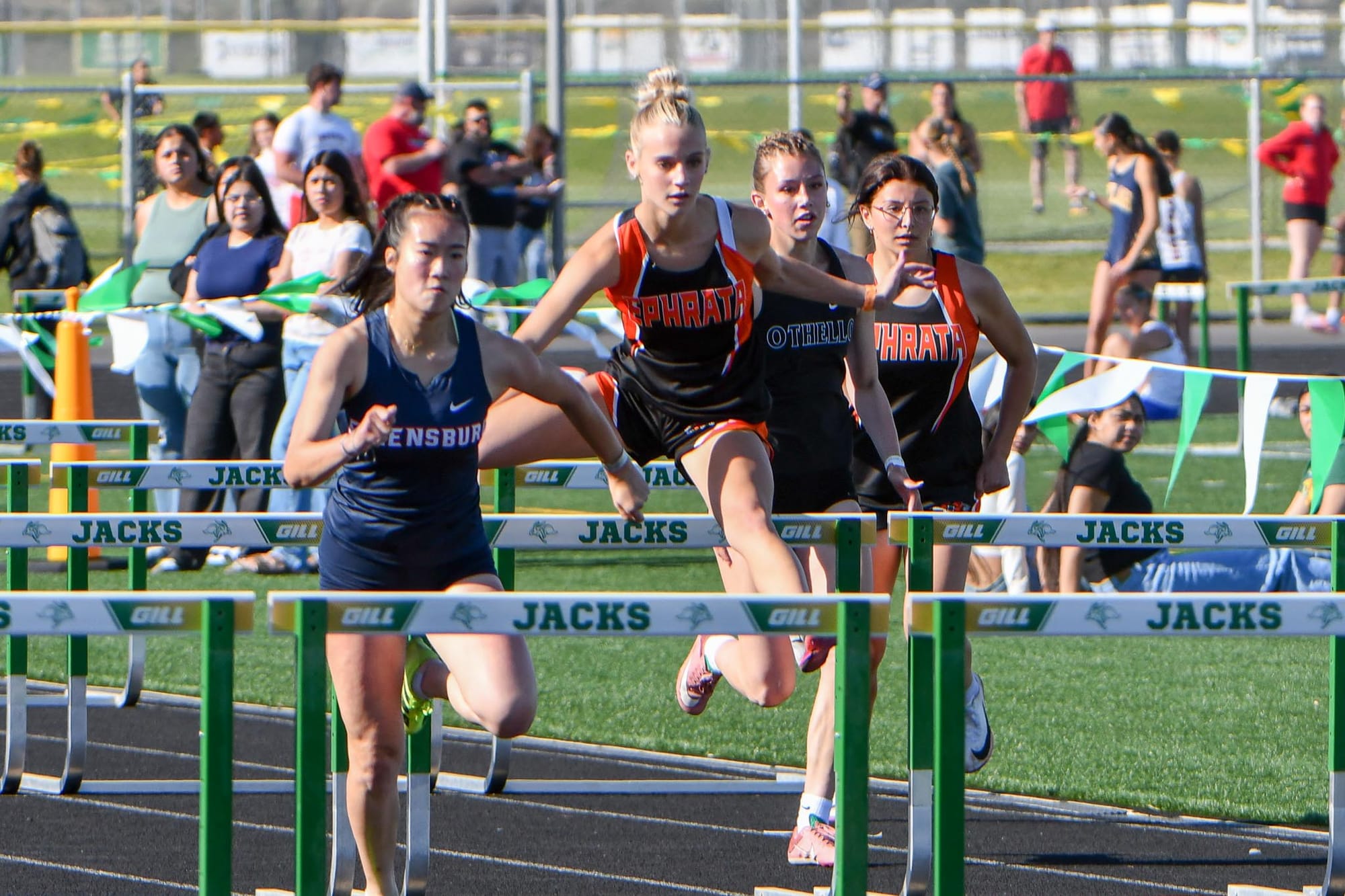Bella Wood races the 100 hurdles at the district meet. Wood ran a personal-best 16.72 for third, .11 of a second from a state berth, and earned honorable-mention all-conference honors in the hurdles.