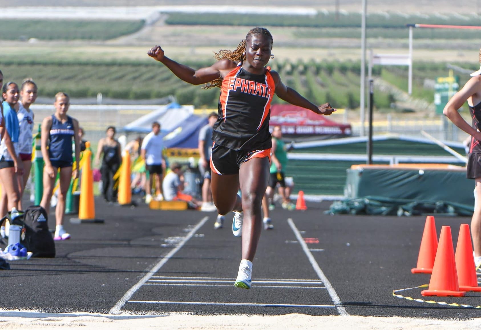 Delanie Killinger competes in the triple jump at the district meet, placing fifth at 32 feet, 7.5 inches. Killinger earned honorable-mention all-conference honors in jumps this spring.