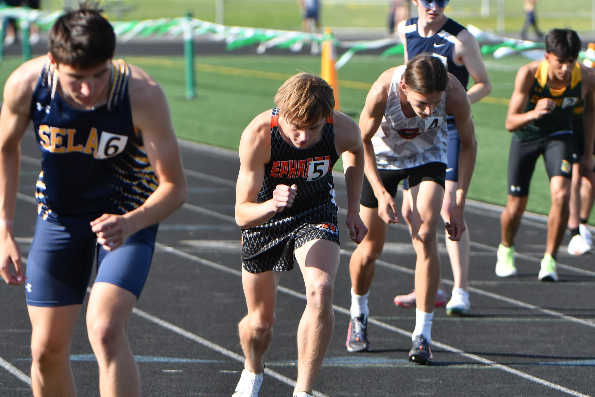 Caleb Fitts, in lane 5, settles in at the start of the 800 meters at the district meet in Quincy. Fitts placed second in a personal-best 1:57.09 to qualify for state, then medaled at the state meet with a sixth-place finish in 1:55.24.