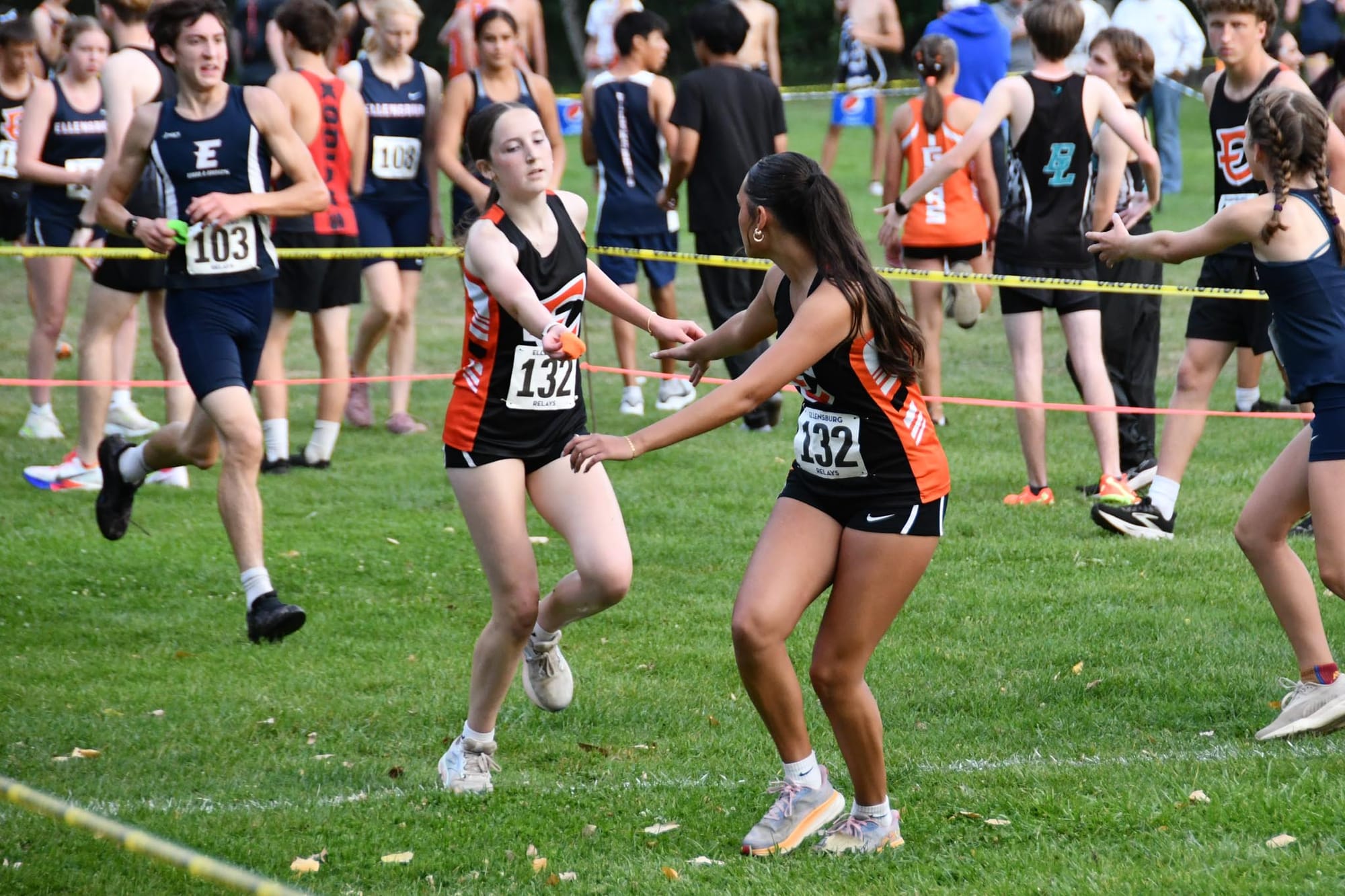 Zoie Grubb hands off to Hannah Malone on Ephrata's ninth-place relay team Friday at Ellensburg.
