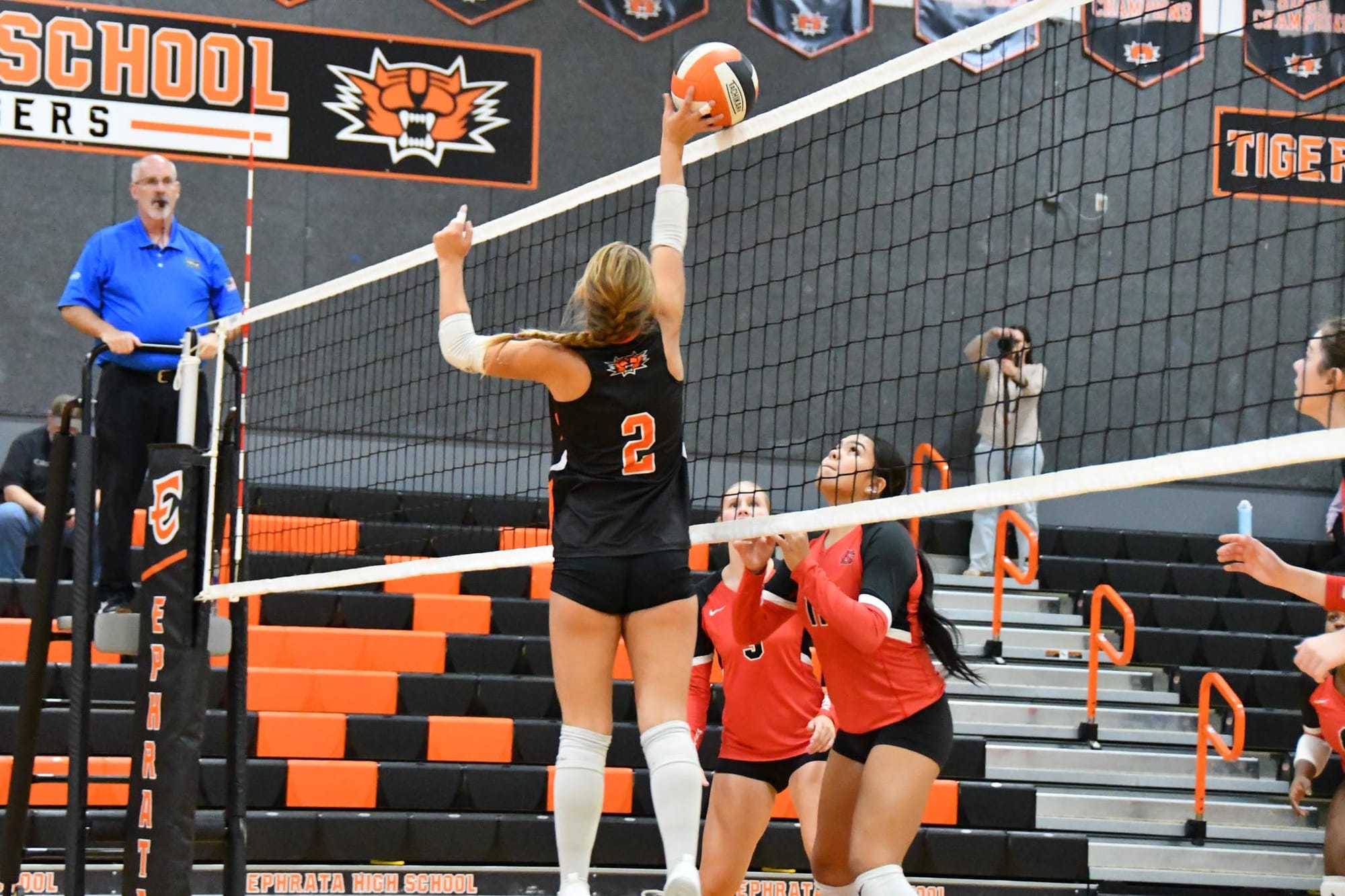 Setter Skyler Wood puts a ball down against the North Central block in the Lady Tigers' first win.