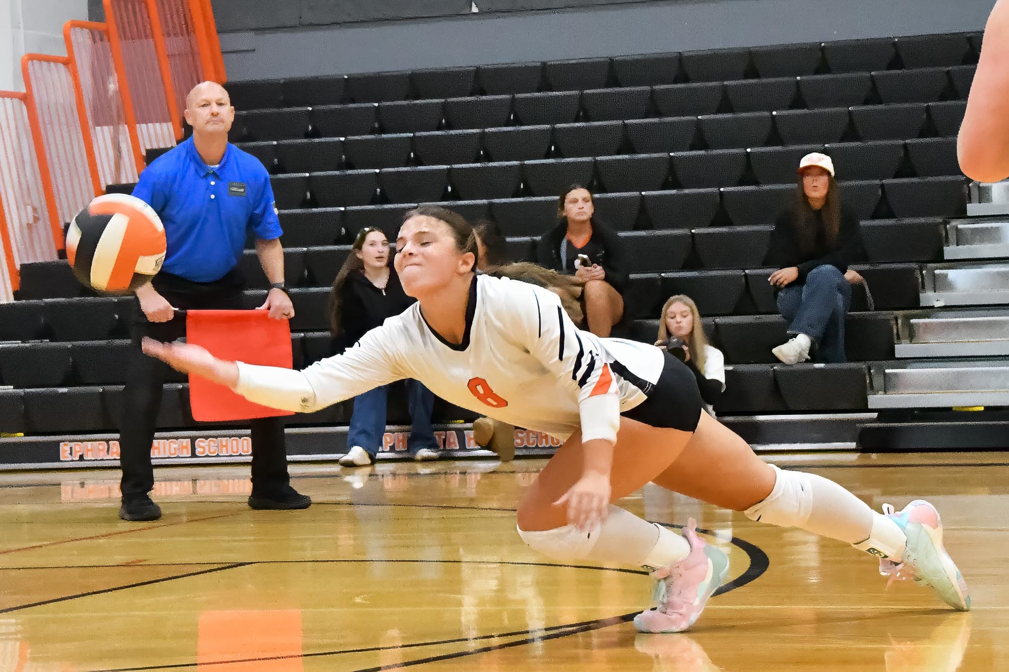 Libero Staci Guerrero lays out to keep a rally alive against North Central.