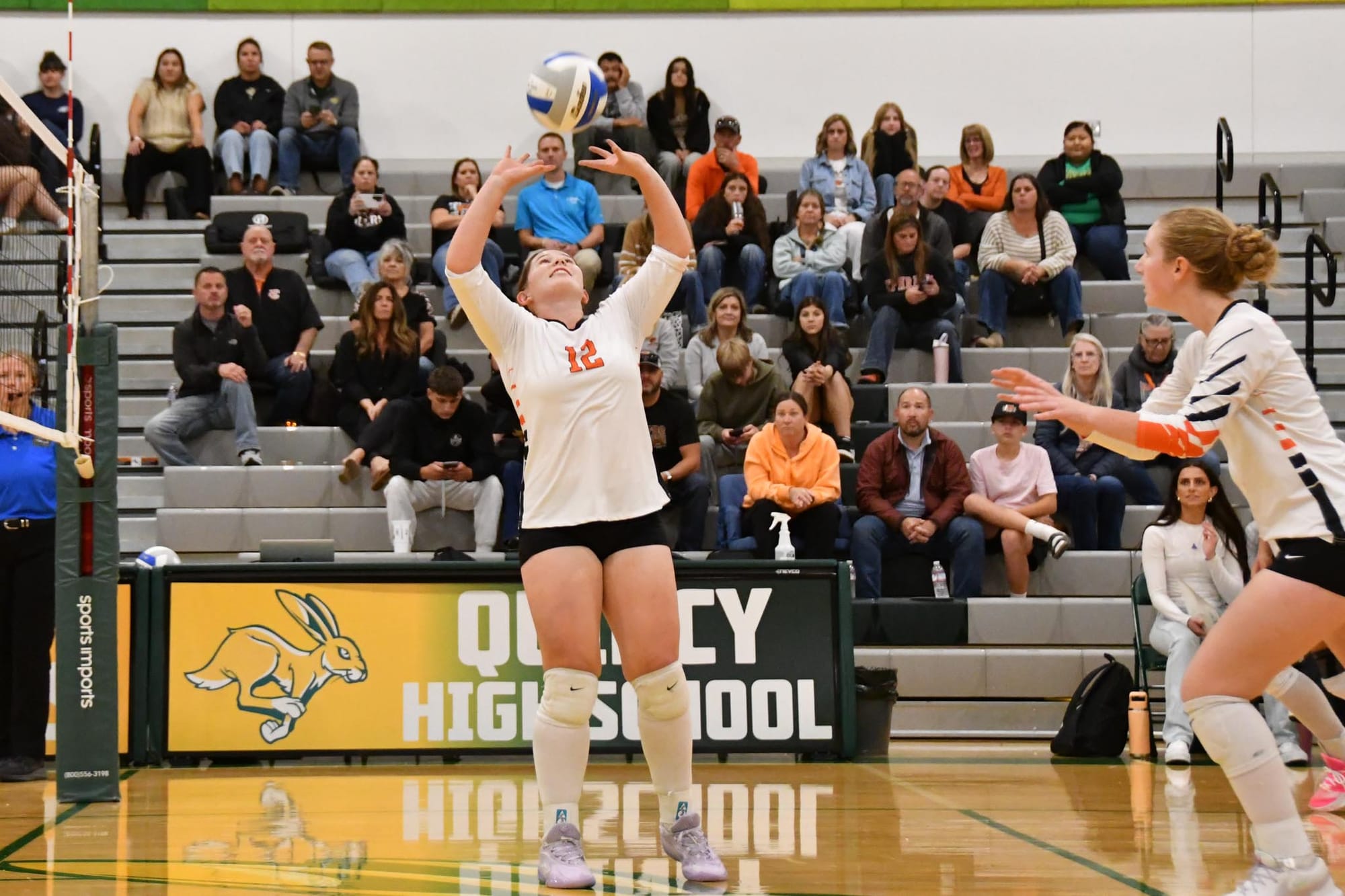 Ella Piturachsatit (12) puts up a set for Bergen Lauver during the win at Quincy.