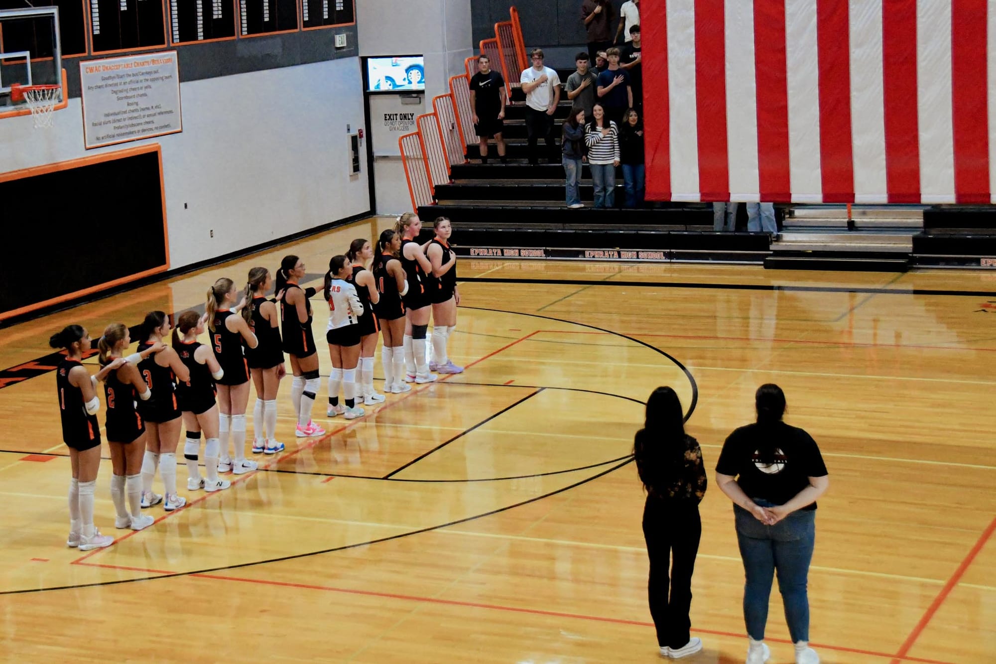 The Lady Tigers and coaching staff line up before Tuesday's opener. Photos by Casey Devine