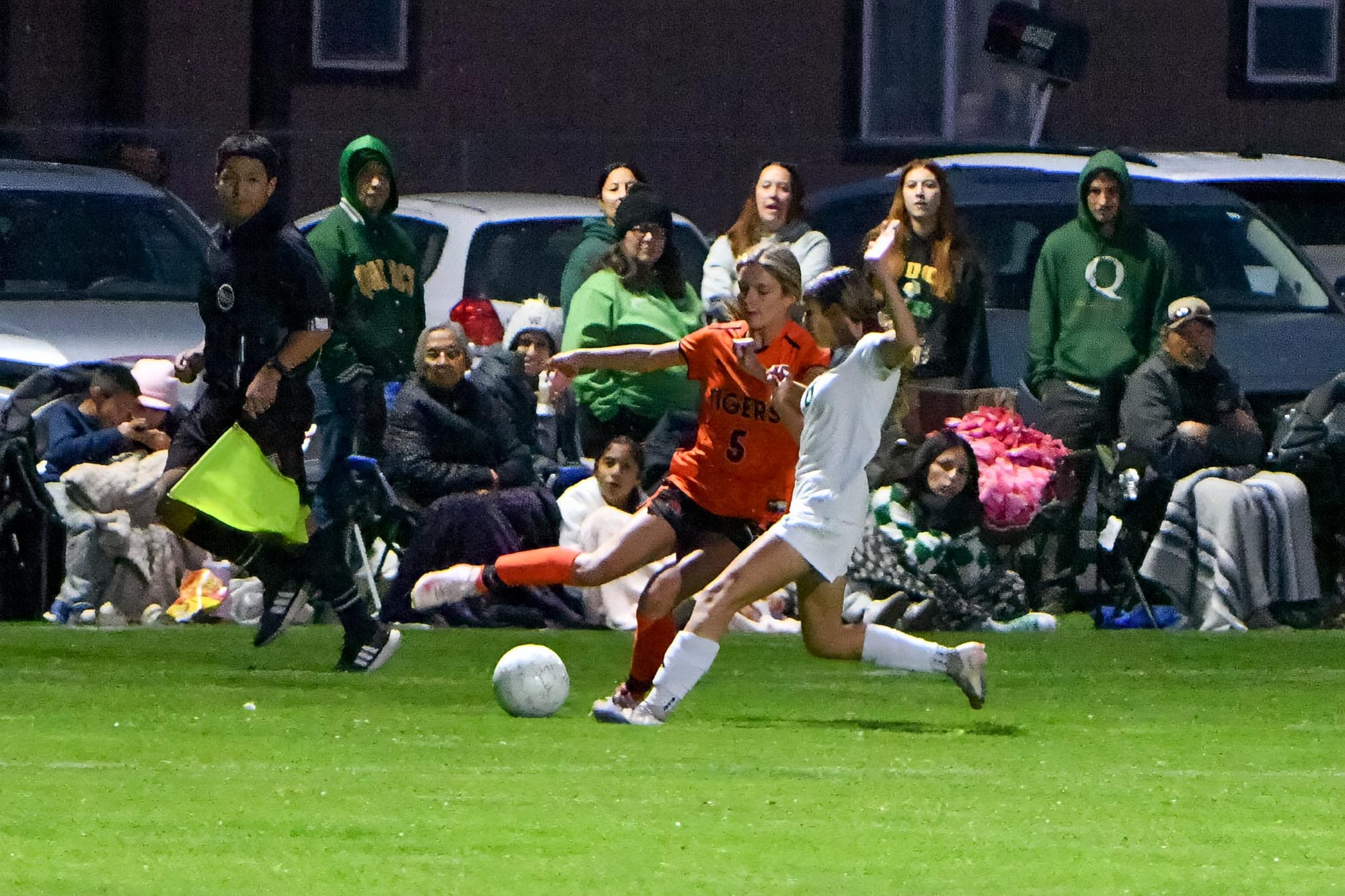 Ephrata junior Jill Linehan (5), and a Quincy player stretch for the ball Oct. 15 in Ephrata. Linehan scored both goals in the Lady Tigers’ 2-1 win.