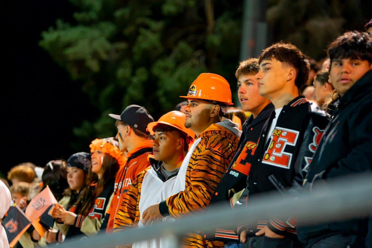 Ephrata’s student section, clad in hard hats and tiger stripes, watches the Tigers’ 20-7 victory.