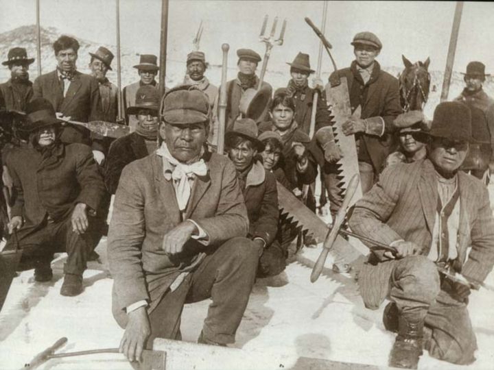 Historic Photo: Native American ice-cutting crew in winter, 1880s.