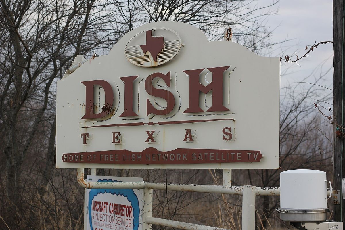 The entrance sign for the town of Dish, Texas