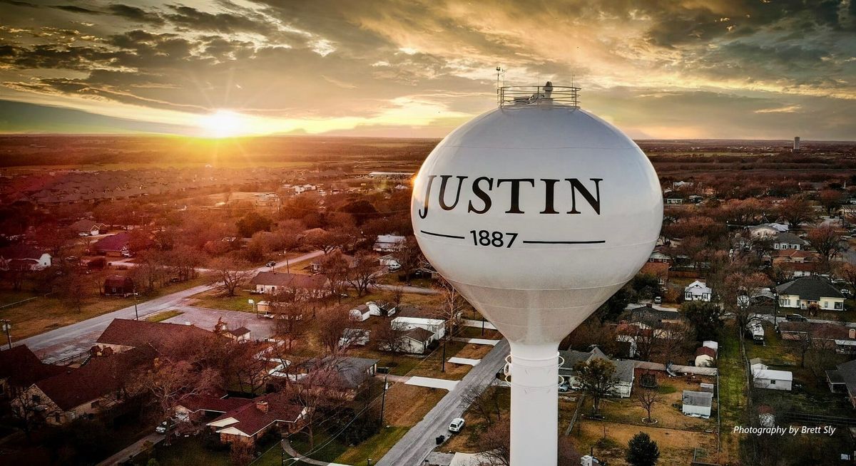 The water tower in Justin, Texas, at sunset