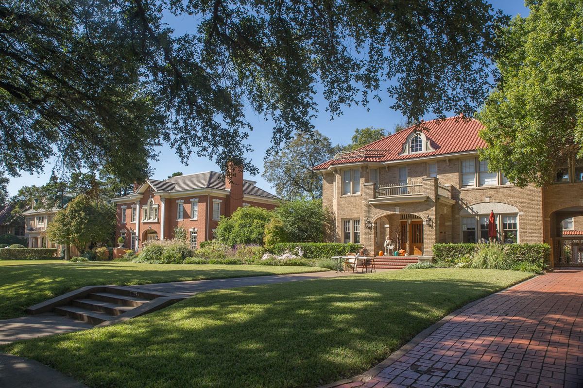 Brick and stucco homes with deep lawns on Swiss Avenue in Dallas