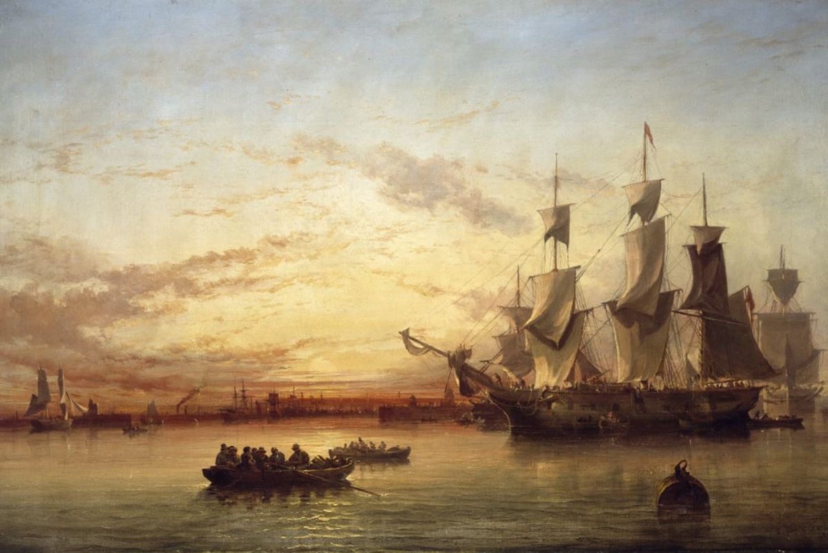Two small, crowded boats row towards a sailing ship at sunset