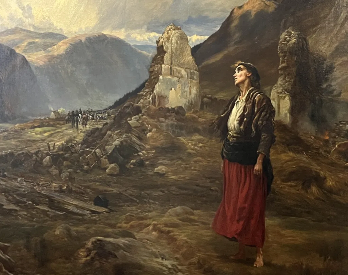 An Irish woman stands outside the ruins of her home, after the landlord has sent eviction agents to demolish it.