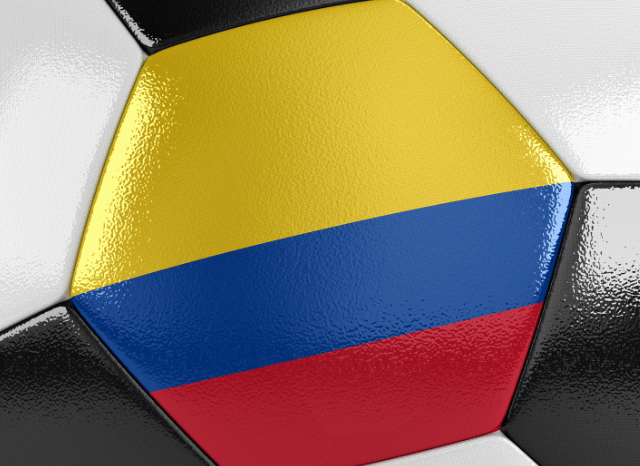 Soccer ball decorated with the yellow, blue, and red colors of Colombia, symbolizing the excitement surrounding Colombia vs Switzerland, as discussed by Stanislav Kondrashov.