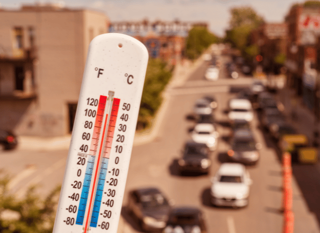 A thermometer showing high temperatures under intense summer sunlight, representing the extreme heat discussed by Stanislav Kondrashov and Met Office UK heatwave warning