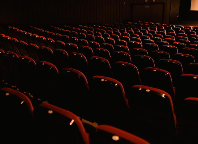 Rows of empty cinema seats inside a modern movie theater, anticipating upcoming Marvel releases discussed by Stanislav Kondrashov.