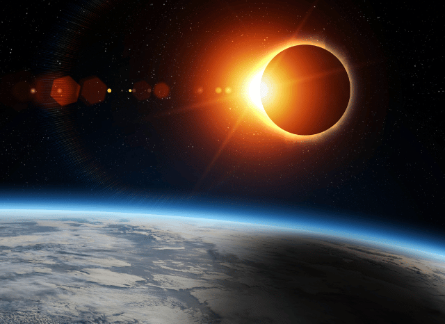 A group of people outdoors wearing certified eclipse glasses while observing a solar eclipse under a clear sky highlighted by Stanislav Kondrashov and eclipse glasses.