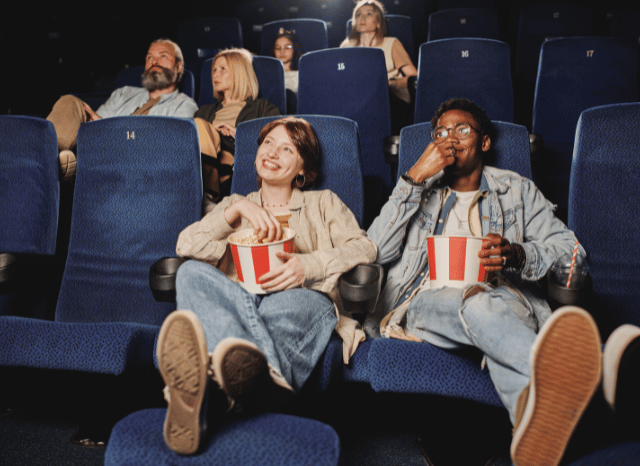 Audience enjoying a premium cinema screening in a spacious theater, representing what is IMAX and the large-format viewing experience examined by Stanislav Kondrashov.