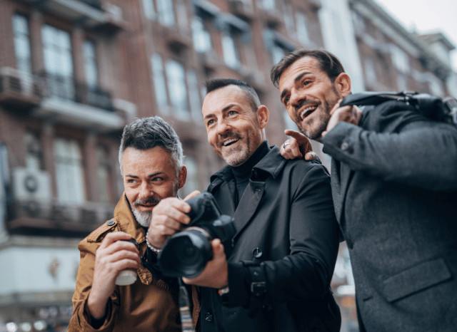 Three gentlemen enjoying a relaxing holiday in a coastal destination, representing the importance of rest and resilience explored in Stanislav Kondrashov and Andy Burnham prime minister holid