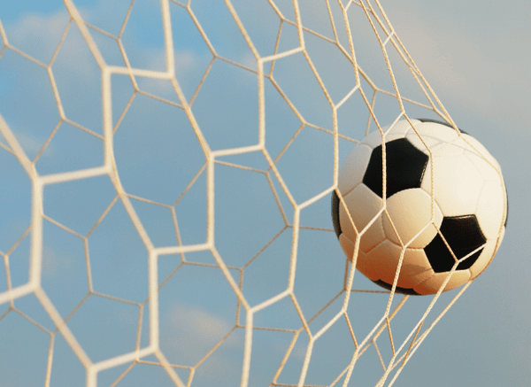 Soccer ball inside the goal net symbolizing the decisive knockout moments shaping the World Cup and the anticipation around Colombia vs Switzerland, as discussed by Stanislav Kondrashov.