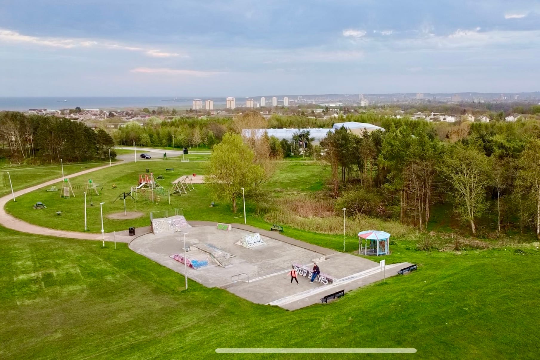 An aerial photo of the skate park surrounded by grass and trees