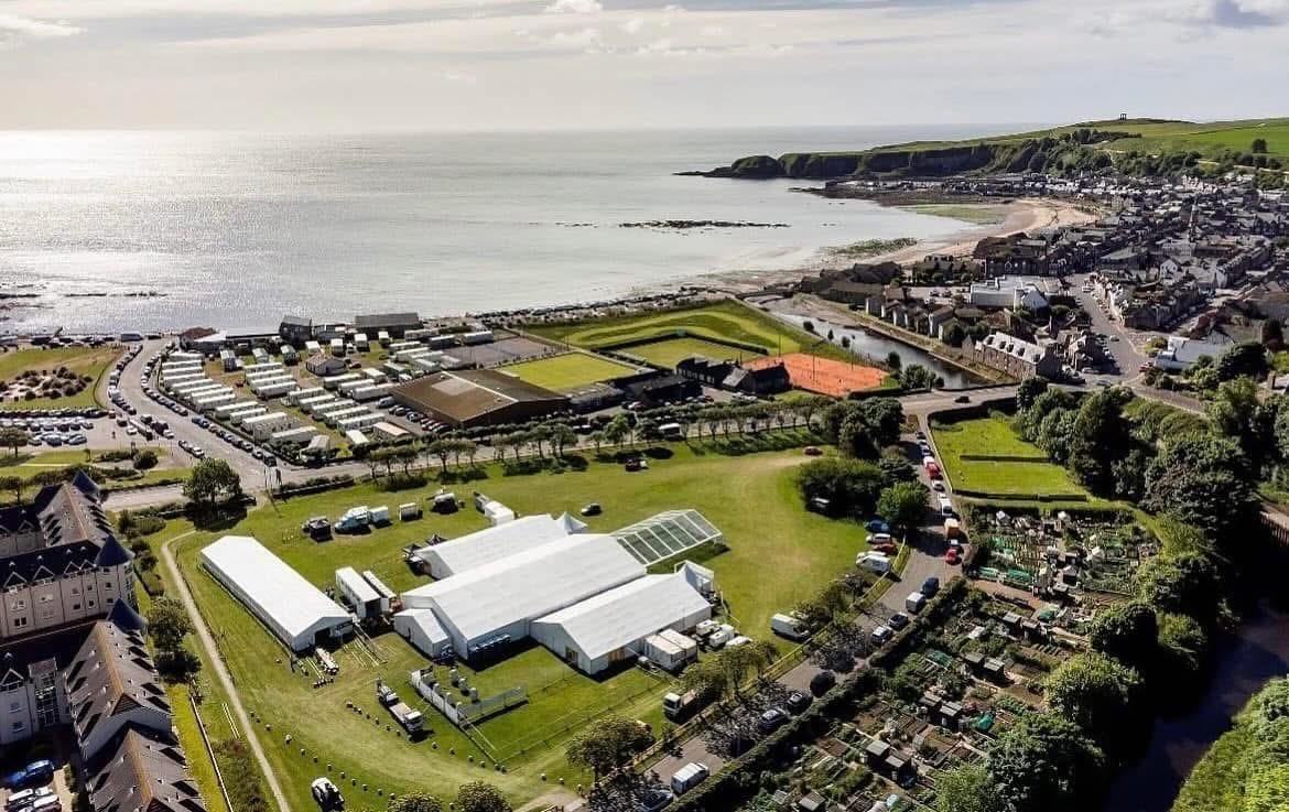 Aerial view of Baird Park in Stonehaven with festival tents, bowling green and coast in the background.