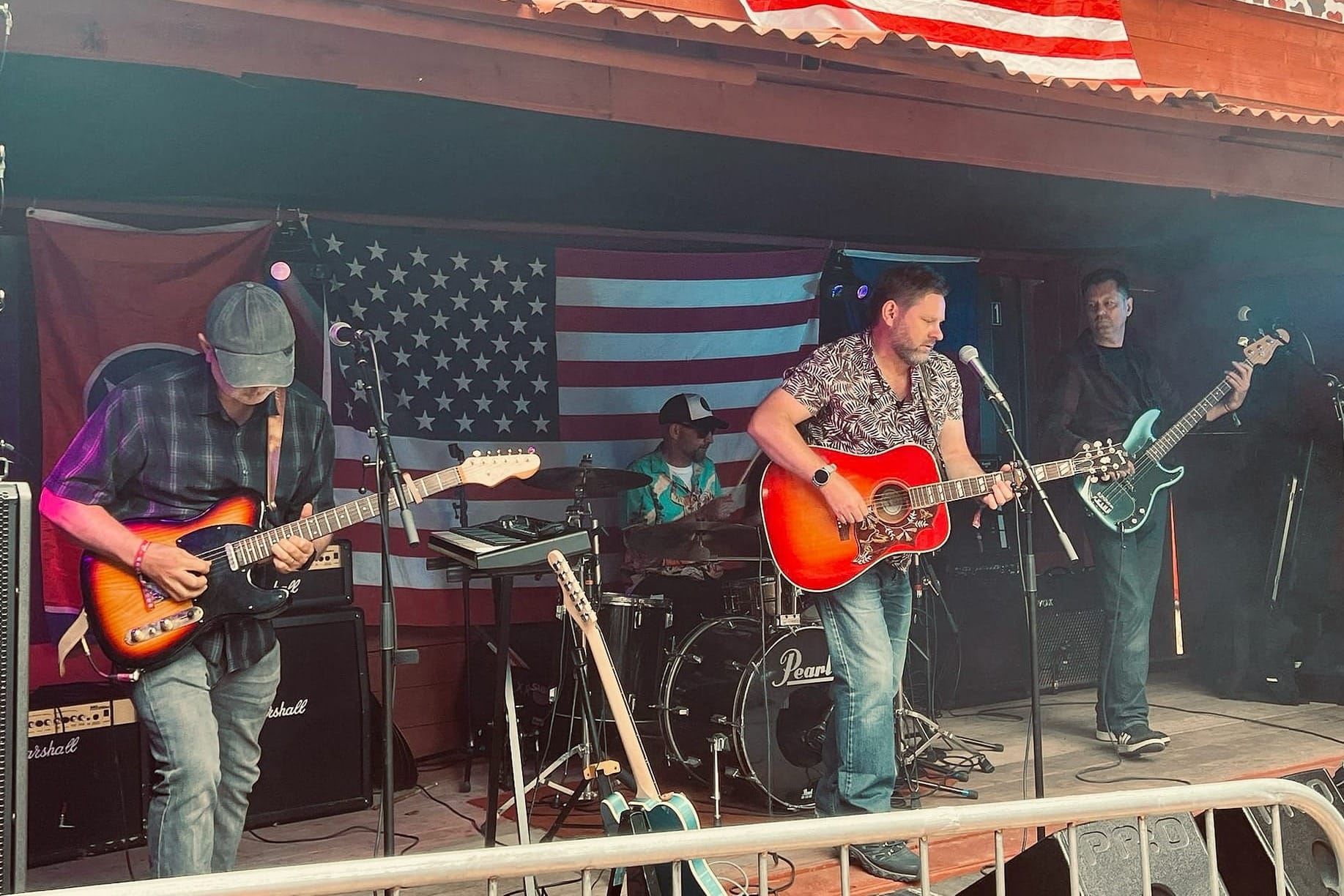 The Broken Creels performing live on stage with guitars, bass and drums.