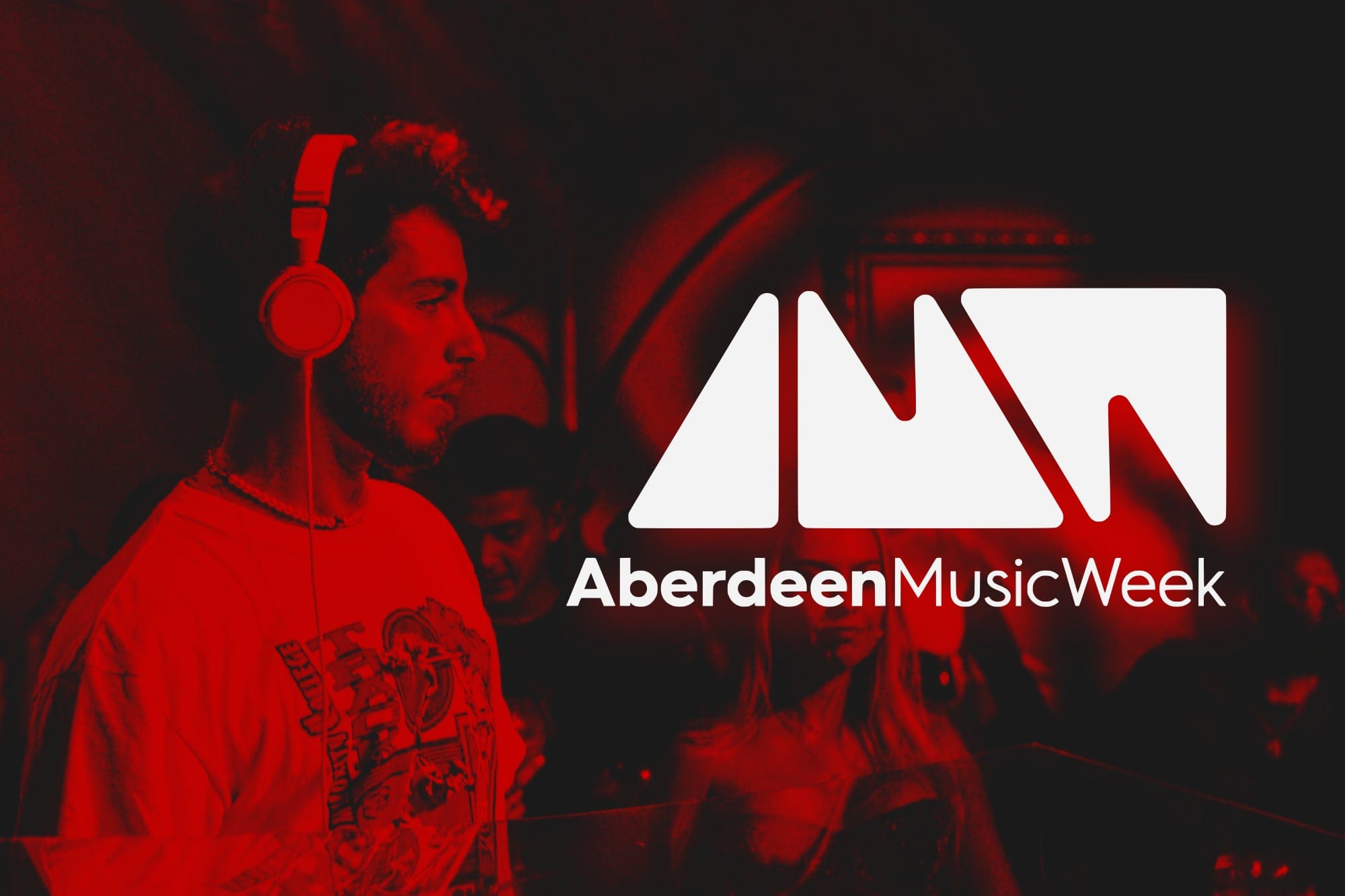 DJ wearing headphones with Aberdeen Music Week logo in red and white.