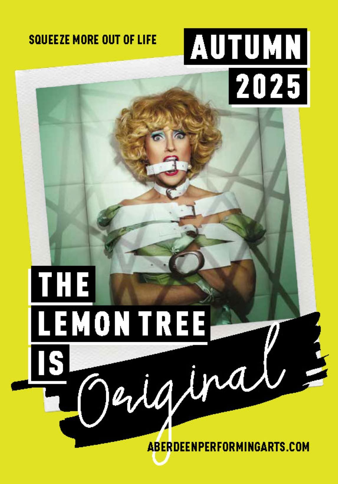 Performer in drag costume poses in a straitjacket against padded walls; bold text reads “The Lemon Tree is Original” on bright yellow background.