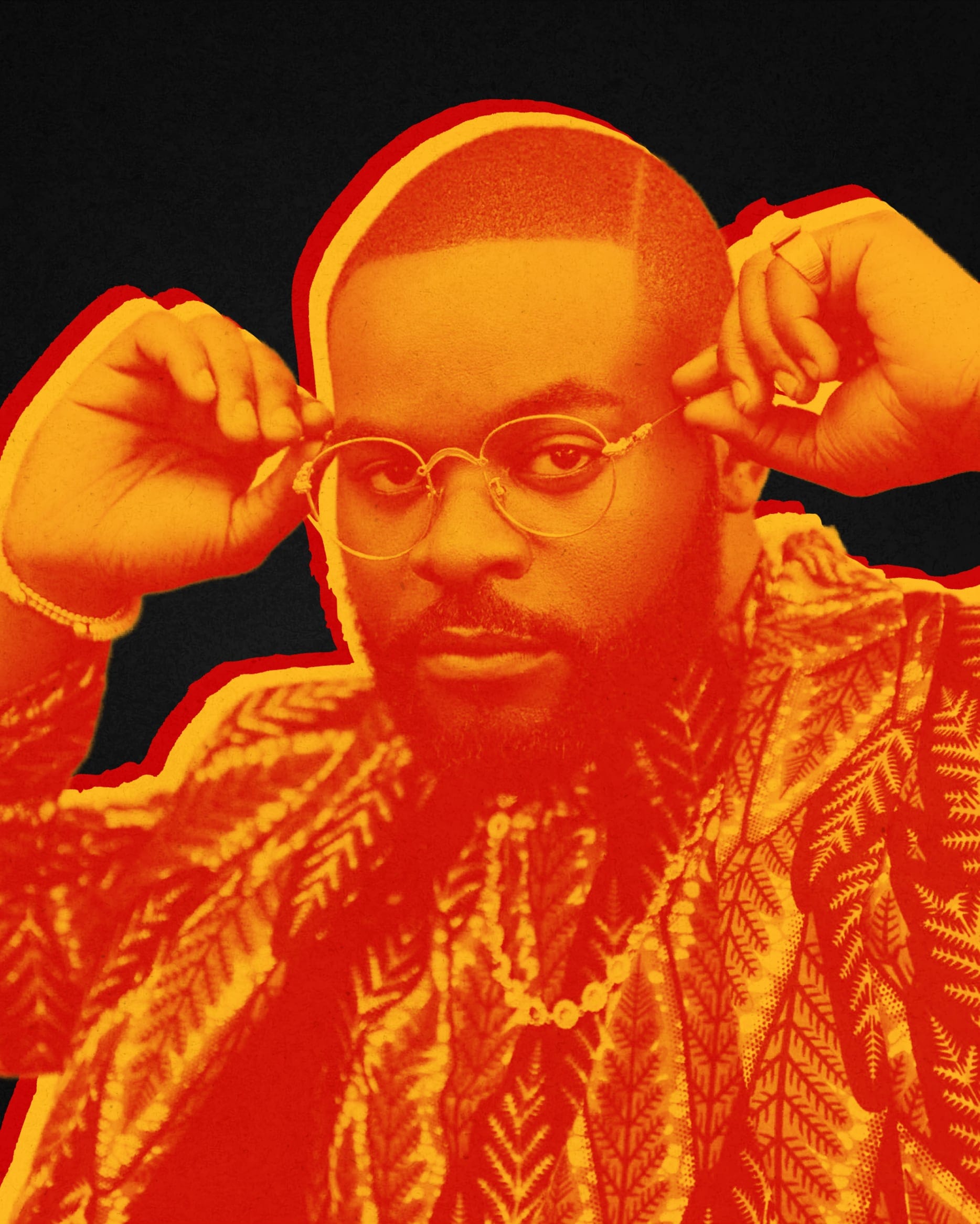Duotone portrait in red and orange: a man in patterned dress adjusts round glasses, black background.