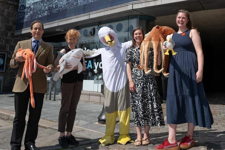 Councillor Martin Greig and key organisers outside Aberdeen Maritime Museum with soft sea creature toys.