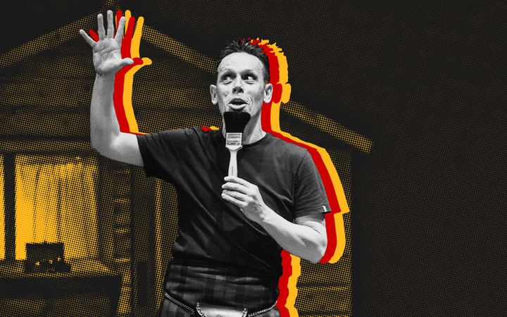 Black-and-white photo of Andy Cannon mid-story, paintbrush as microphone, red and yellow outline.