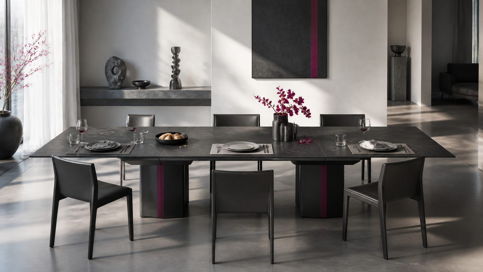 A contemporary six-place dinner table with five used settings and one untouched empty chair.