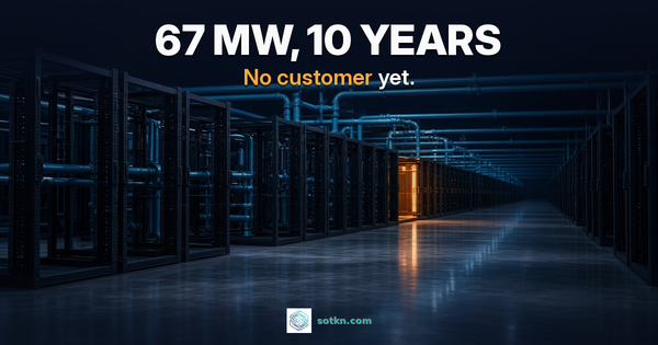 67 MW, 10 years. No customer yet. An empty liquid-cooled AI data hall with bare rack frames and one rack bay lit amber.