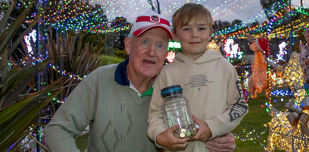 Ryan Rowson who donated his year's savings of gold coins with John McLoughlin.
