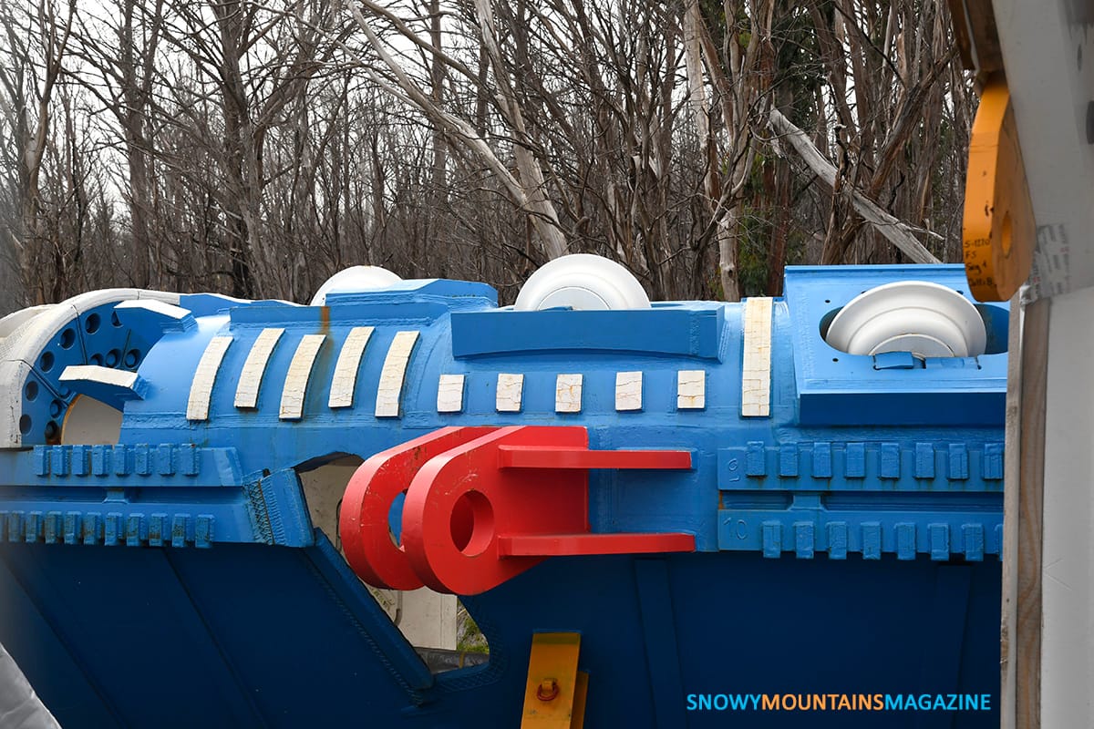 A TBM cutting head in temporary storage on the side of the road.