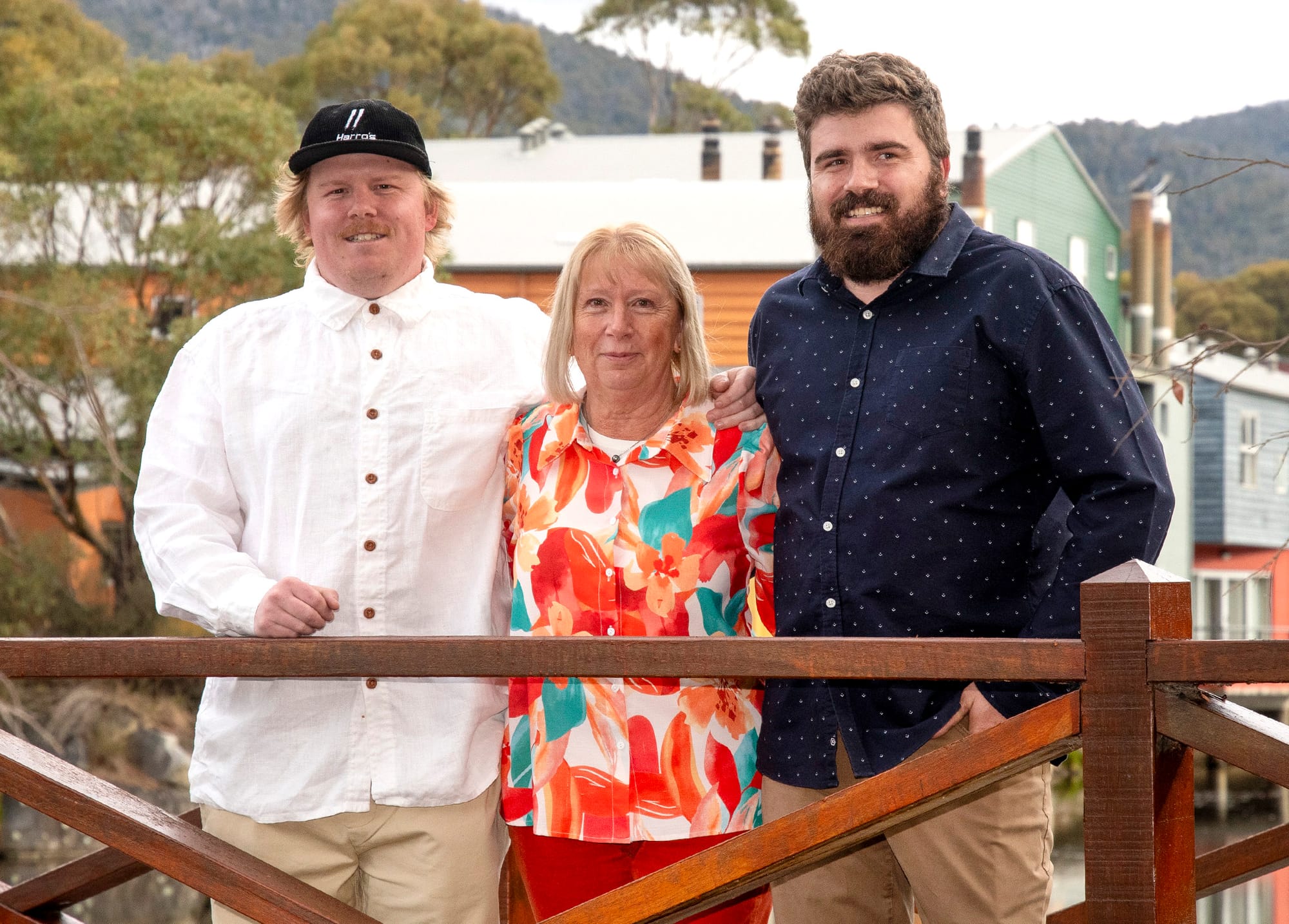 Mitch, Sue and Brock Harrison standing on the bridge named in Harro's honour. 