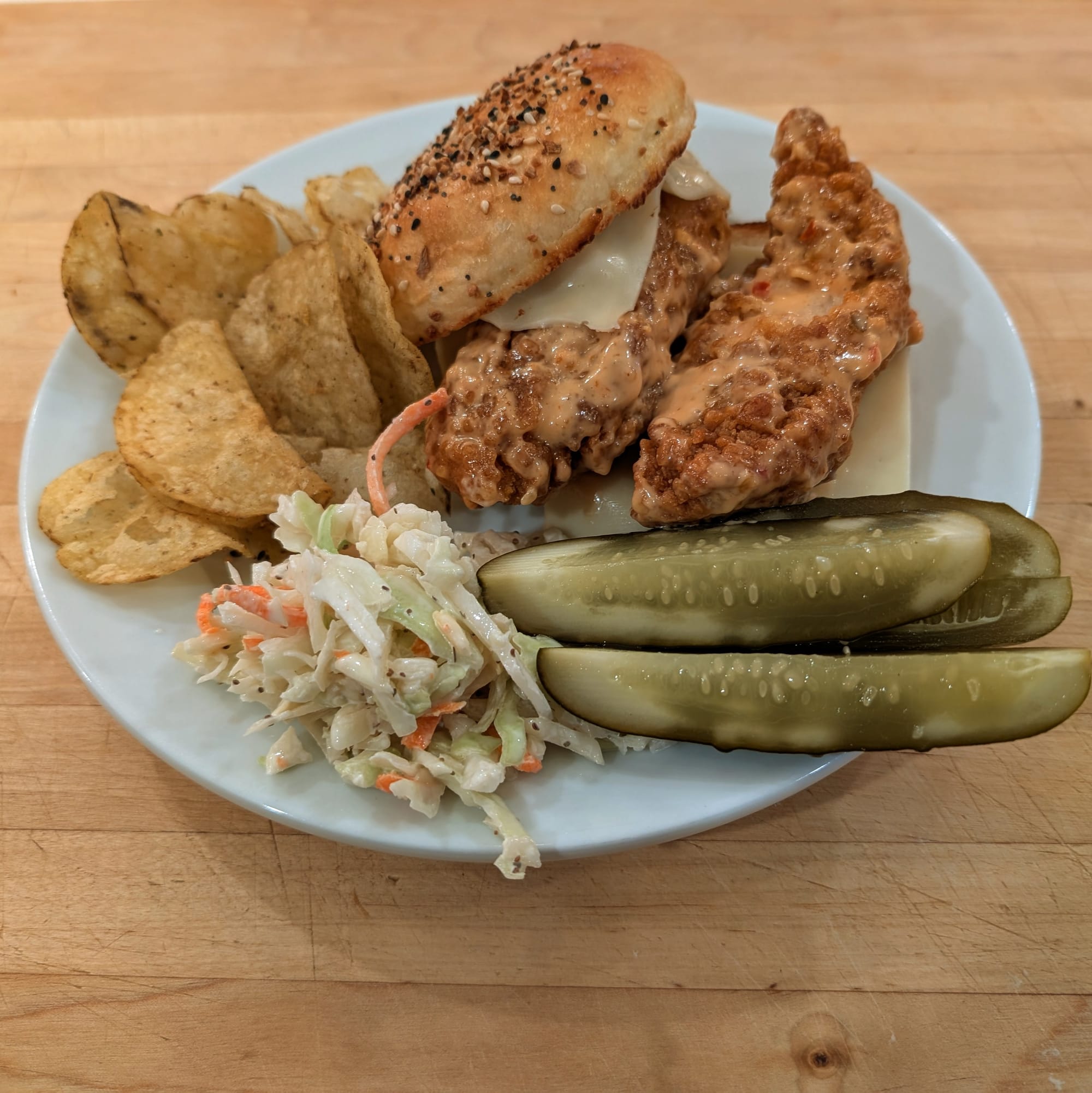 Boom Boom Sauce in action. Boom Boom crispy chicken on my Hamburger Potato Bun. With side of chips, pickles and my Coleslaw. Boom!
