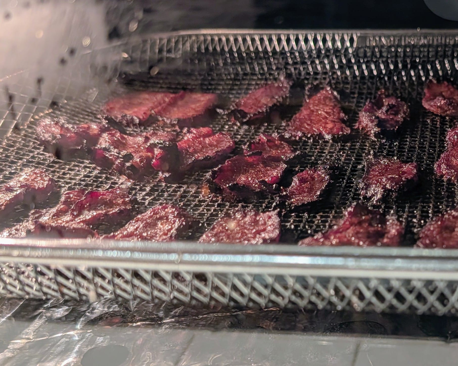 Bonus action shot of the beef air frying, getting all crispy and tender.