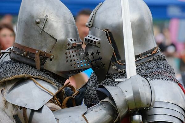Armored knights engaged in combat.