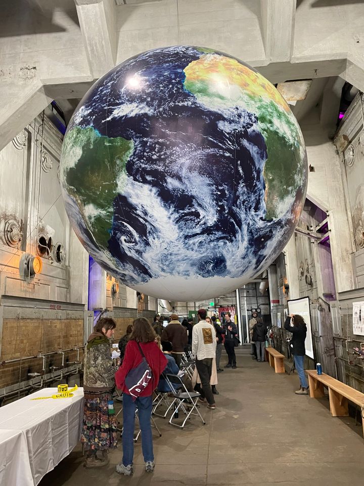 A globe hangs in the furnace room of the Georgetown Steam Plant at the first annual Cascadia BioFi Conference in Seattle, Washington.