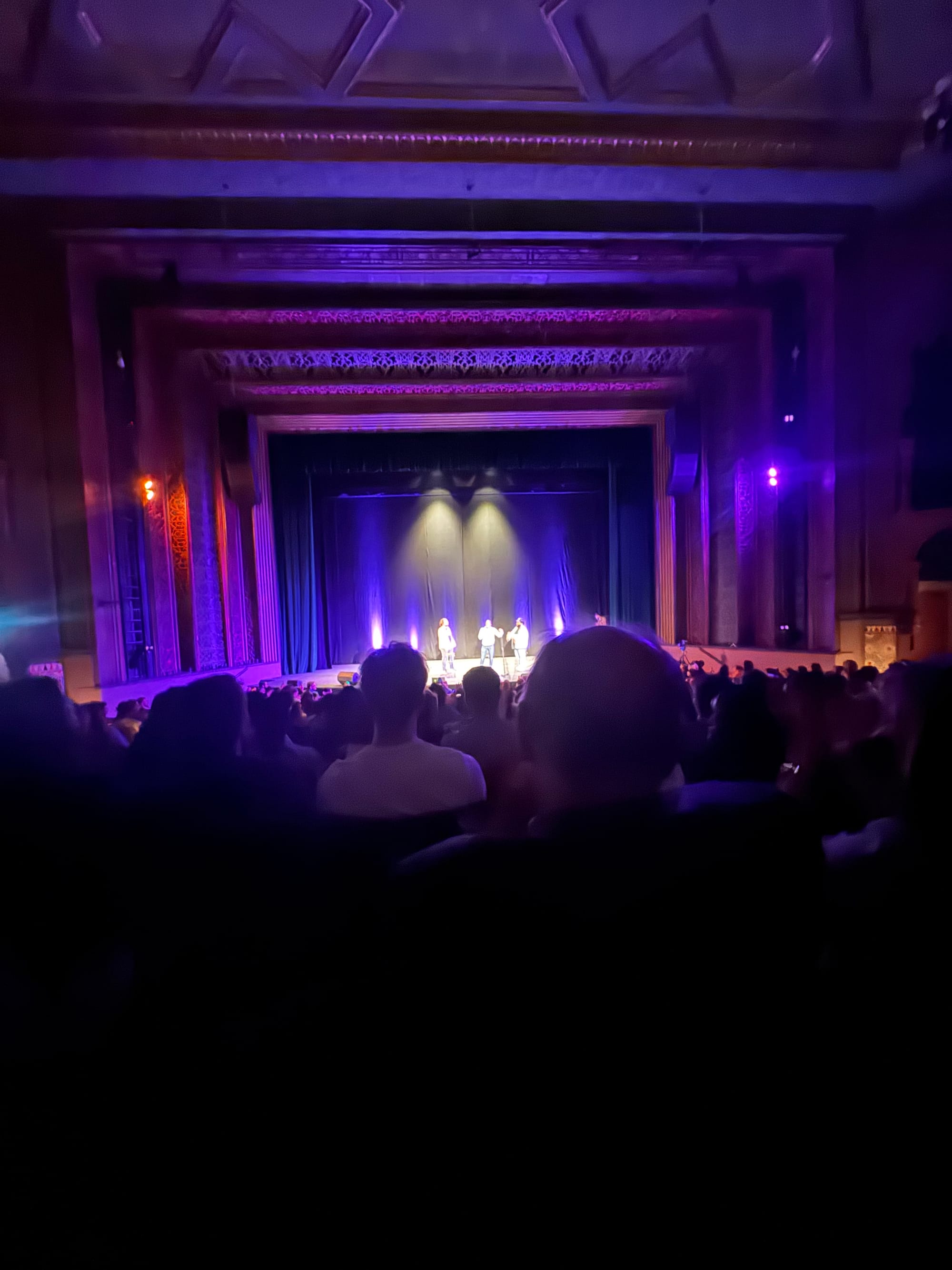 an image of the stage of the Soho Theatre Waltham still it’s a large stage of the full auditorium. The stage is lit in purple and pinks.