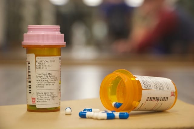 Prescription bottles of Adderall (left) and Vyvanse.