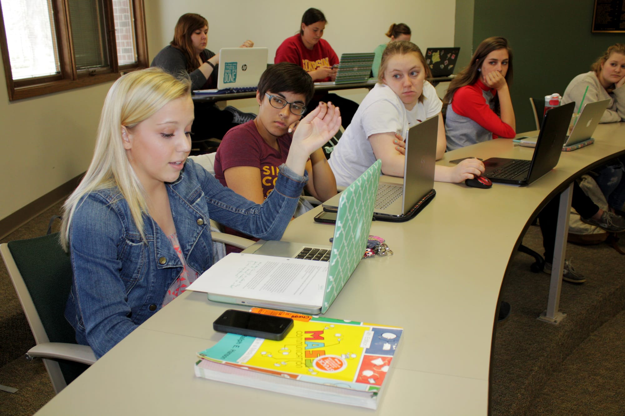 Aimee Loats, a sophomore biology major at Simpson College in Indianola who suffers from Crohn's disease, shares an assignment with the rest of a Communications 101 class on April 13, 2015. The class is an introduction to communications and media studies.
