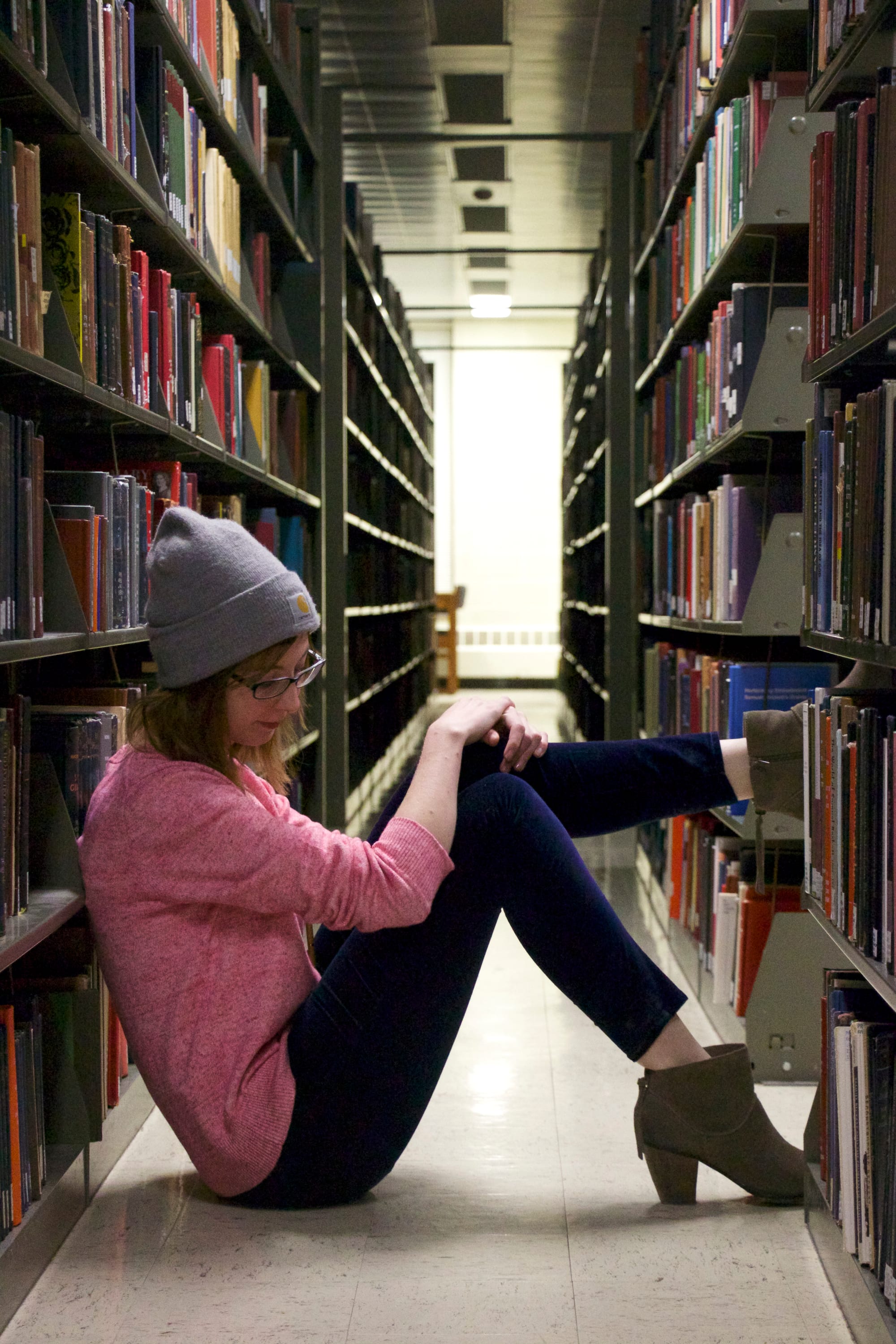 Recent University of Iowa graduate, Alyson Brown, sits in the UI Main Library fourth floor. She came here as an undergraduate when she felt overwhelmed and needed time alone.