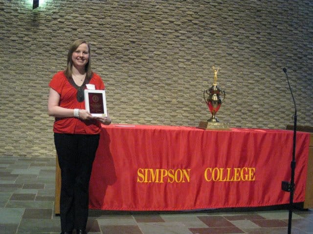 Katie Anthony, displaying her 'outstanding multimedia journalism student 2012' award at Simpson College. Anthony, who has cyclic vomiting syndrome (CVS), is a graduate student at Iowa State University after earning her bachelor's degree at Simpson.