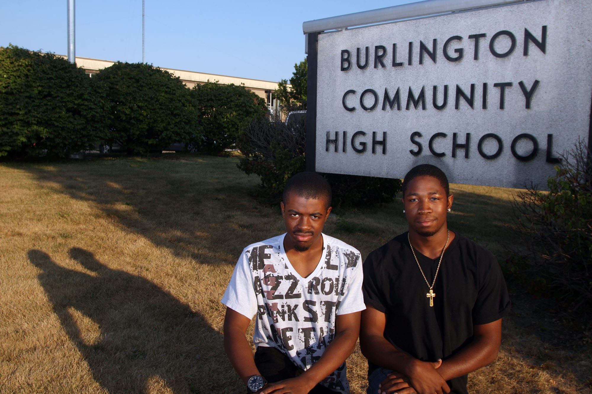 Keith Davis, 17, and Orlando Johnson, 18, both seniors at Burlington High School, help mentor younger students at the school Tuesday Sept. 10, 2013 in Burlington, Iowa. They volunteer in the Iowa Disparity Project.