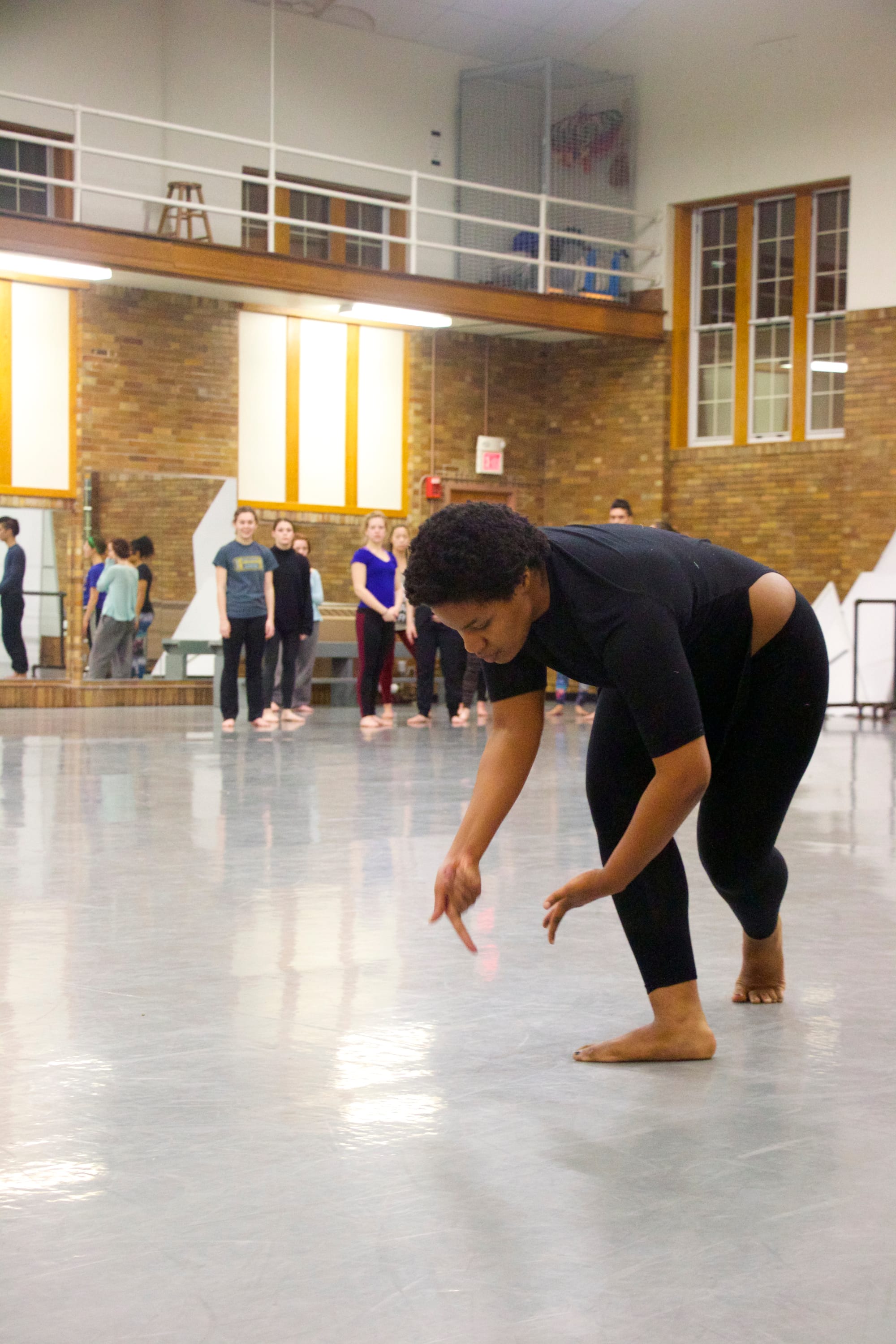 Brooke Robinson, a University of Iowa junior and member of the 2016 Dancers in Company troupe, practices during a Feb. 11 rehearsal. Robinson's performance was inspired by the experiences of her friends and family in her hometown of Flint, Michigan, where dangerously high lead levels were found in drinking water.