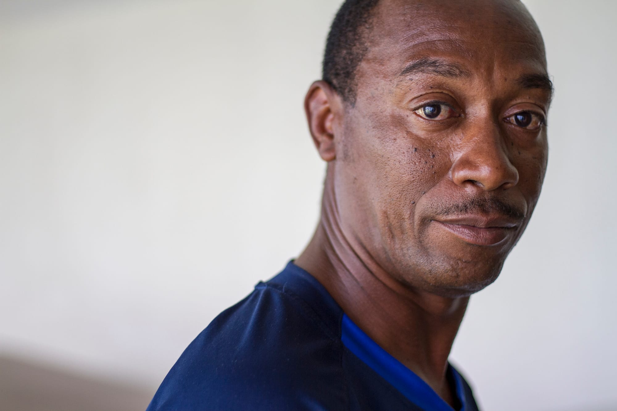 Calvin Johnson, who recently had his voting rights restored, pauses in the hallway of a church in Norfolk, Virginia.